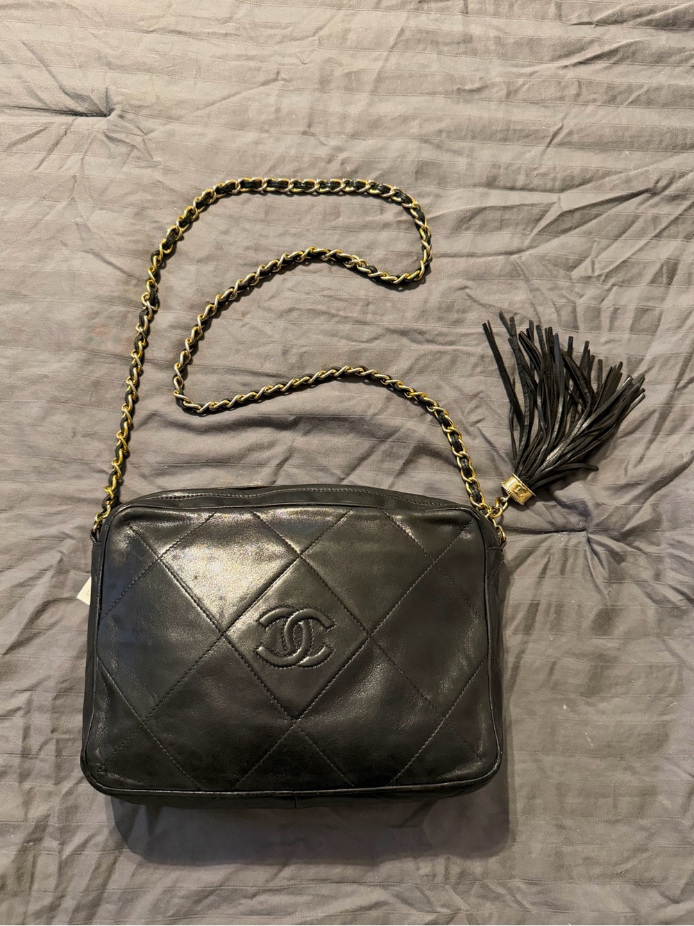 CHANEL Black Quilted Leather Crossbody Bag with Tassel and Chain
